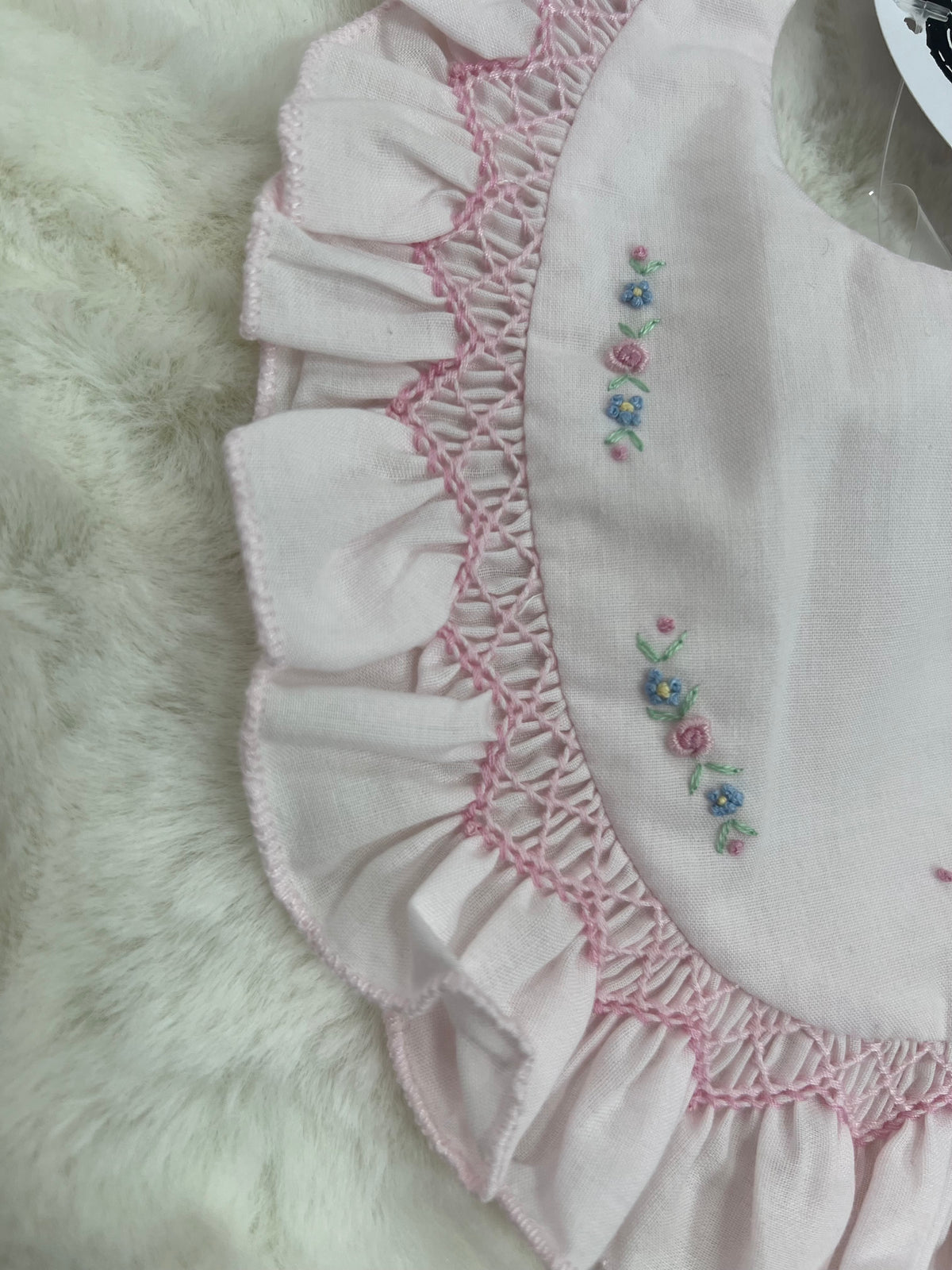 Pink smocked floral bib